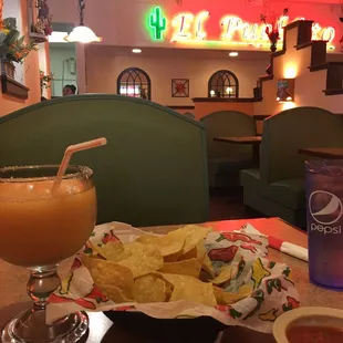 "Medium" peach margarita. Pretty good. The salsa was the best part of the meal.