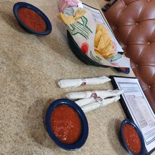 The chips are thin, warm and crisp.  Salsa is slightly smoky with just a tiny bite of heat.  Quite tasty!