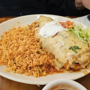 Lengua burrito with enchilada sauce, cheese, and sour cream. No beans inside. The meat was so tender!