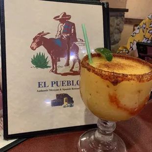 a drink in a glass on a table