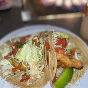 two fish tacos on a plate