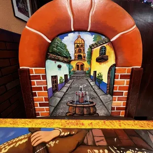 a mural of a man playing a guitar