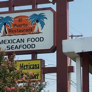 a sign for a mexican food seafood restaurant