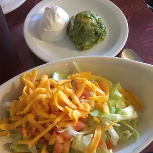 Side salad, side guacamole and sour cream.