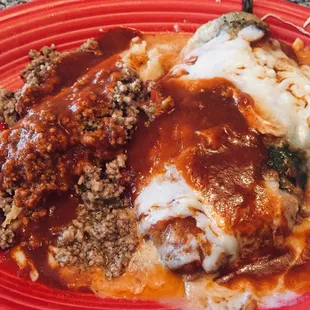 a plate of food with meat, mashed potatoes and gravy