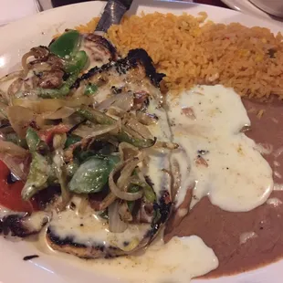 Grilled chicken breast topped with onions, peppers, tomatoes and cheese.