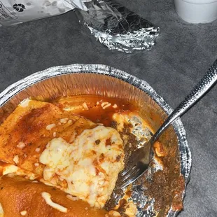 a plate of enchiladas with sauce