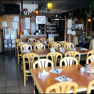 The dining room, as you enter, with the counter, and the window to the kitchen in the rear.