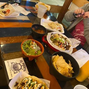 Surf and Surf N Turf Taco, Friar Fries, Fish Ceviche Tostada, Guacamole with chips