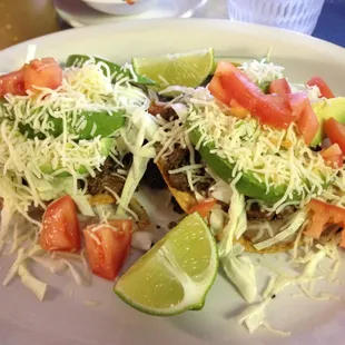 I love these Chalupas del Puesto. They are made with cabbage and lettuce and tomato with asada meat. Yum.