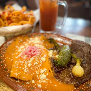 Enfrijoladas de queso con Carne Asada