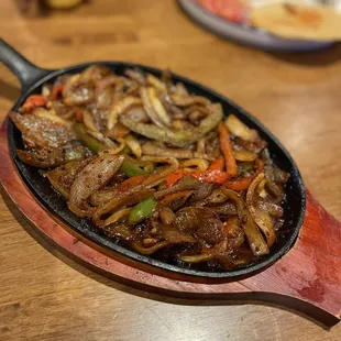 This is supposed to be their "Trio Fajitas" Got a loaded skillet full of vegetables hardly any meats
