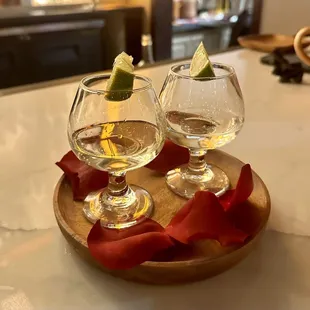 Tequila shots plated with fresh red roses