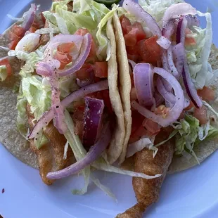 two fish tacos on a plate