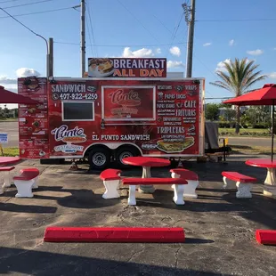 in font of a fruit stand on US-27 and Cagan
