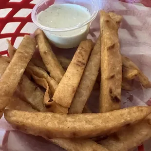 Fried tortilla with creamy cilantro dip