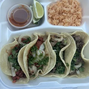 4 tacos with a side of rice. 2 al pastor and 2 carne asada.