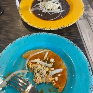 Hard tortilla with a salsa and cheese and hard tortilla with black beans