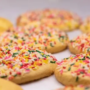 a tray of cookies with sprinkles