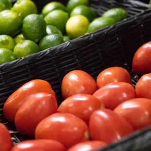 tomatoes and limes in baskets