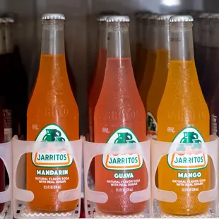 a row of bottles of fruit and juice