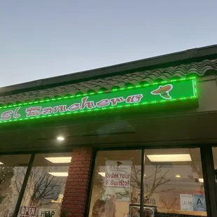 a neon sign for a mexican restaurant