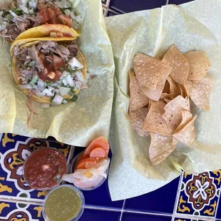 Two tacos, chips, and salsa. With drink it's a $10 meal.