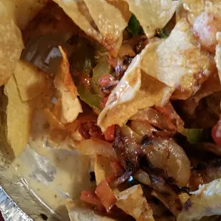 This is a carry out order of shrimp nachos.  Absolutely disgusting and inedible.  The menu does not list veg in this, bad shrimp, no cheese.