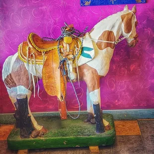 a horse with saddle and saddle