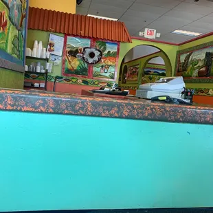 a blue counter with a green counter top