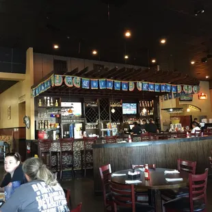 people sitting at tables in a restaurant