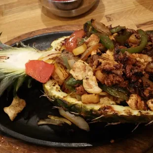 The fajitas tropicales- beef, chicken and shrimp with chorizo, vegetables and grilled pineapple.