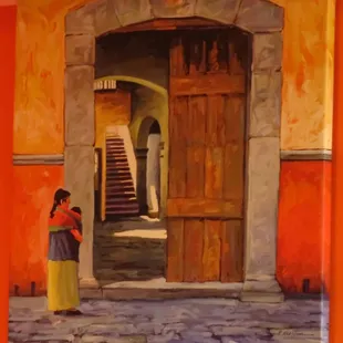 a woman standing in front of a doorway