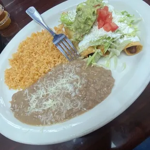 Chicken &amp; potato flautas with rice and beans.