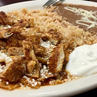 Had the Red Chilaquiles, Great Red sauce flavor, chicken has way over season and rice over cooked but had good flavor
