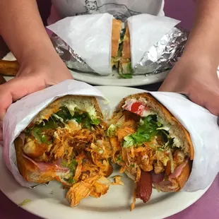 a person holding a sandwich