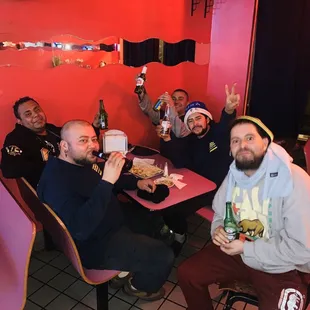 a group of men sitting at a table
