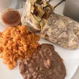 Bacon breakfast burrito and beans and rice combo