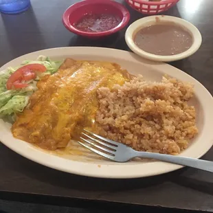 Cheese enchiladas! Refried beans soupy! Rice smells funny!Enchiladas edible but swimming in grease or fat!