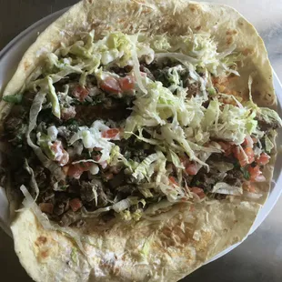 6.50 steak burrito. That is a chinette platter!  It's huuuuge. Minimal beans and rice mostly veg and steak!