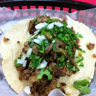 Steak taco with green sauce