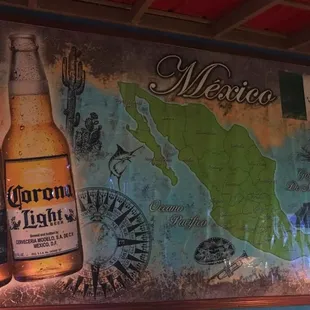 a map of mexico and two beer bottles