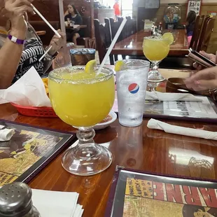 people sitting at a table with drinks