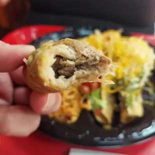 a person holding a plate of food