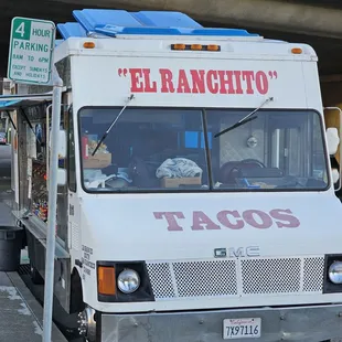 a taco truck parked on the side of the road