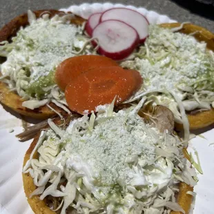 2 carne asada and 1 carnitas sopes