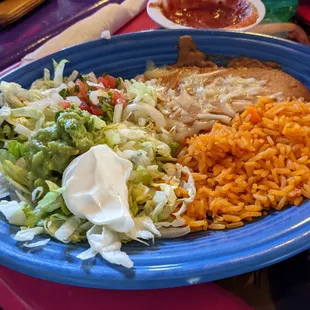 Rice and Refried beans that come with Chicken Fajita