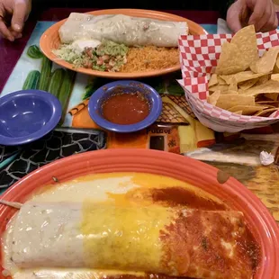 Chiefs Burrito!! Beef burrito with rice, beans, avocado, &amp; sour cream, smothered w/queso blanco, yellow queso, &amp; red sauce! Go chiefs
