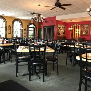 a dining room with tables and chairs