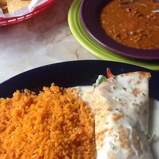 17A Burrito De Fajitas with Mexican rice and charro beans.